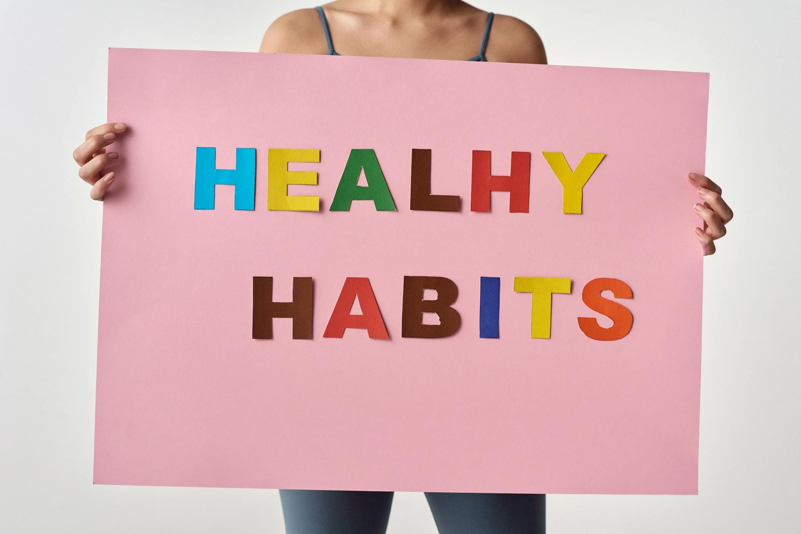 Person Holding a Pink Poster with Message