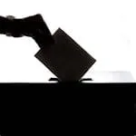 Person Dropping Paper On Box