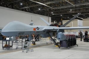MQ-9 Reaper remotely piloted aircraft carrying Hellfire missiles in flight.